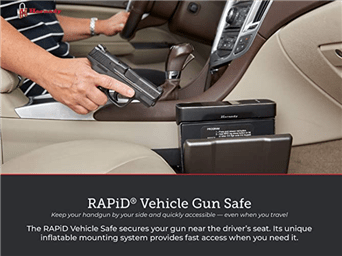 hand holding a gun inside the car